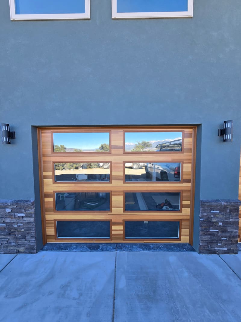 exterior multi windowed garage door with multi colored wood exterior panels garage door installation repair salida colorado that garage door guy